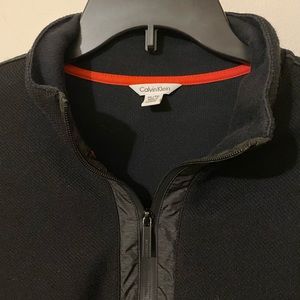 Black Calvin Klein pull over.